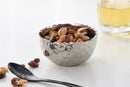 Pampa Bay Millennium porcelain snack bowl with a hammered silver-look exterior and a shimmering, crinkled silver interior.