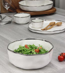 Small serving bowl from the Bianca collection, featuring a white glossy finish and a thin silver line around the edge.