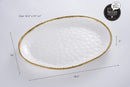 Dimensions for White porcelain oval serving platter with a gold beaded rim displayed on a white background.