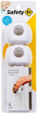 Four white plastic door knob covers designed for child safety, arranged on a white background.