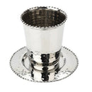 Silver hammered Kiddush cup with beaded detailing and matching saucer on a white background.