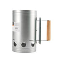 Silver steel charcoal chimney starter with a wooden handle, shown from an angle.