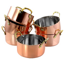 A small, round copper mini Dutch oven with a silver interior and two gold-toned loop handles.