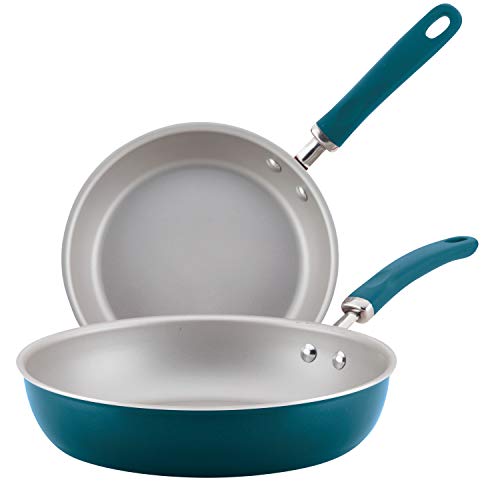 Blue nonstick frying pan set with stainless steel and silicone handles, includes one 9.5-inch and one 11.75-inch pan, displayed on a white background.
