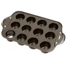 A black nonstick mini cheesecake pan with 12 round cups and silver metal handles on both ends.
