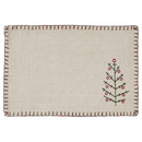 A rustic, off-white rectangular placemat with a whipstitched dark red border. A stylized embroidered Christmas tree with red ball ornaments is on the bottom right corner of the placemat.