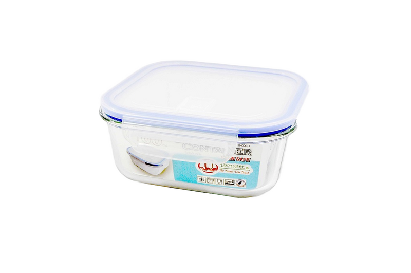 A transparent rectangular glass food storage container with a blue-rimmed airtight plastic lid. The container has secure locking clips on the sides and a label indicating it is oven-safe, microwave-safe, and BPA-free.