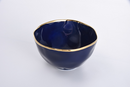 Porcelain serving bowl, 8.5 inches wide and 5 inches deep, Sunset by the Sea navy blue with gold rim.