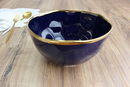 Porcelain serving bowl, 8.5 inches wide and 5 inches deep, Sunset by the Sea navy blue with gold rim.