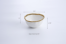 Sophisticated white condiment bowl with a decorative golden beaded border.