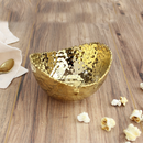 Pampa Bay small oval bowl with a hammered gold finish and textured, organic rim, suitable for serving or decoration.