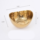 Pampa Bay small oval bowl with a hammered gold finish and textured, organic rim, suitable for serving or decoration.