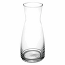 A clear glass wine decanter with a slender neck and a wide base.