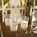 Elegant clear plastic tumblers with a white body and two thin metallic gold rims. Perfect for upscale events, weddings, and parties. 
