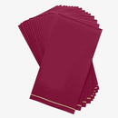 Stack of cranberry red and gold striped guest paper napkins arranged on a white background.