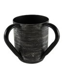 Black ceramic mug with a matte, textured finish and four large, curved handles extending from both the top and bottom sides.