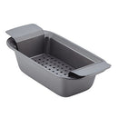 A gray nonstick loaf pan with a removable draining insert, designed for baking meatloaf, shown on a white background.