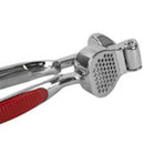 Home Basics Zinc Garlic Press with ergonomic red handles, designed for easy crushing of garlic cloves.