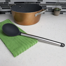 Heat-resistant black silicone kitchen spoon with polished stainless steel handle and hanging loop.