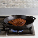 Black cast iron grill pan with dual handles and raised ridges, designed for stovetop or oven cooking.
