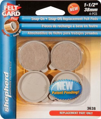 Close-up image of 1-1/2" Snap On Snap Off Replacement Felt Pads, showing their circular shape and soft felt material, designed for use on furniture or appliances to protect surfaces from scratches.