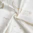 white jacquard napkins with an elegant gold wave pattern