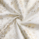 Folded 70" x 108" jacquard tablecloth with gold mosaic print displayed on a white background.