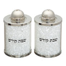 Elegant Shabbat salt and pepper shakers featuring a cylindrical design with sparkling crystal accents. Each shaker is adorned with Hebrew text 'Shabbat Kodesh' and topped with a silver-tone dome lid.