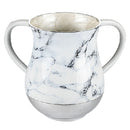 A marble washing cup with two handles, a silver base, and a white and gray marbled pattern. The inside of the cup appears to be a light, shimmery gold or off-white color. The background is white.