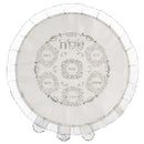 A round, white satin matzah cover with a ruffled edge. It features delicate silver embroidery of the Hebrew word 'Pesach' and six compartments for Seder foods.