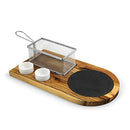 Yukon Glory Burger Serving Set, featuring a wooden board with a metal fry basket, two ceramic ramekins for sauces, and a burger on a round black coaster.