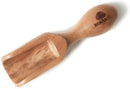 A small, light brown olive wood scoop with a shovel-like end and a rounded handle, featuring "BERARD" engraved on the handle.
