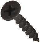A close-up of a Kettle & Cord black drywall screw, featuring a Phillips drive and a bugle head. The coarse threads are prominently visible, showcasing its helical shape and sharp tip against a plain white background.