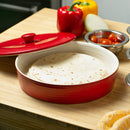 A round, red stoneware tortilla warmer with a ribbed texture, a matching lid, and a small round knob handle.