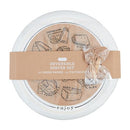 A white ceramic serving platter set wrapped with a kraft paper band. The set is reversible and includes 12 cheese papers and 12 wooden toothpicks. The plate features a drawn guide to various cheeses.