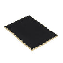 Rectangular black marble cutting board with elegant gold rim on a white background.