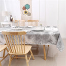 A forest grey jacquard print rectangular tablecloth by Majestic Giftware, neatly spread on a table