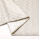 Rectangular gold jacquard zigzag tablecloth laid flat on a white background.